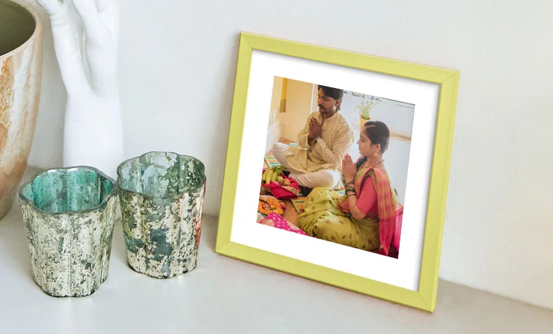 Personalised photographs displayed in coloured photo frames