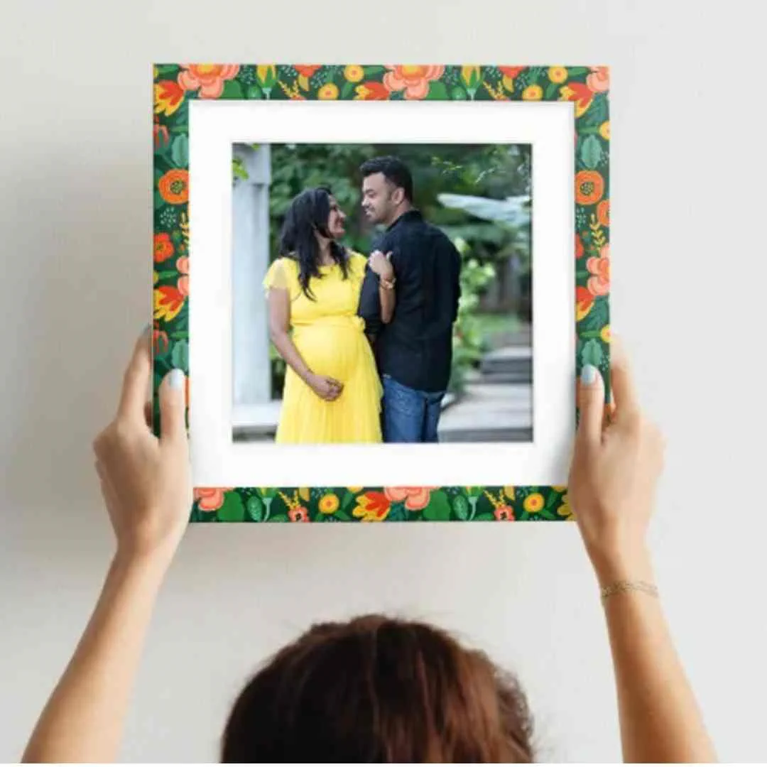 Couple baby shower photo pose with parents-to-be outdoors
