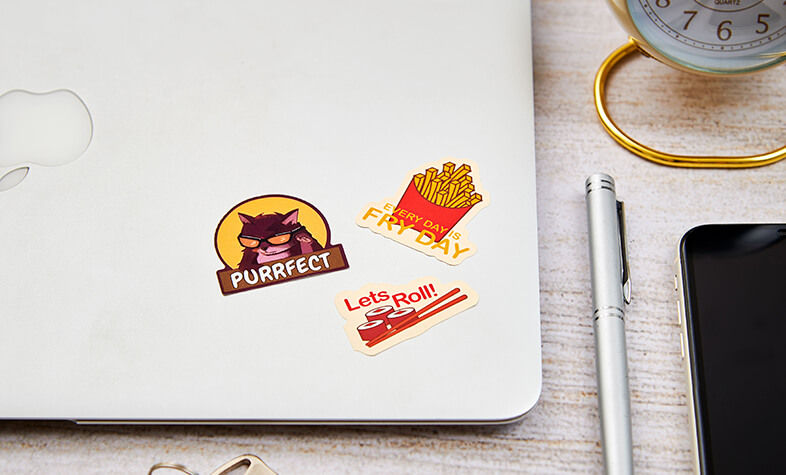 Colourful water-resistant laptop stickers chosen for a friend’s gadgets